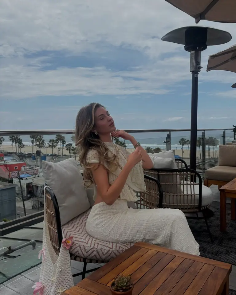 Nina relaxing on a rooftop above the Los Angeles beachfront